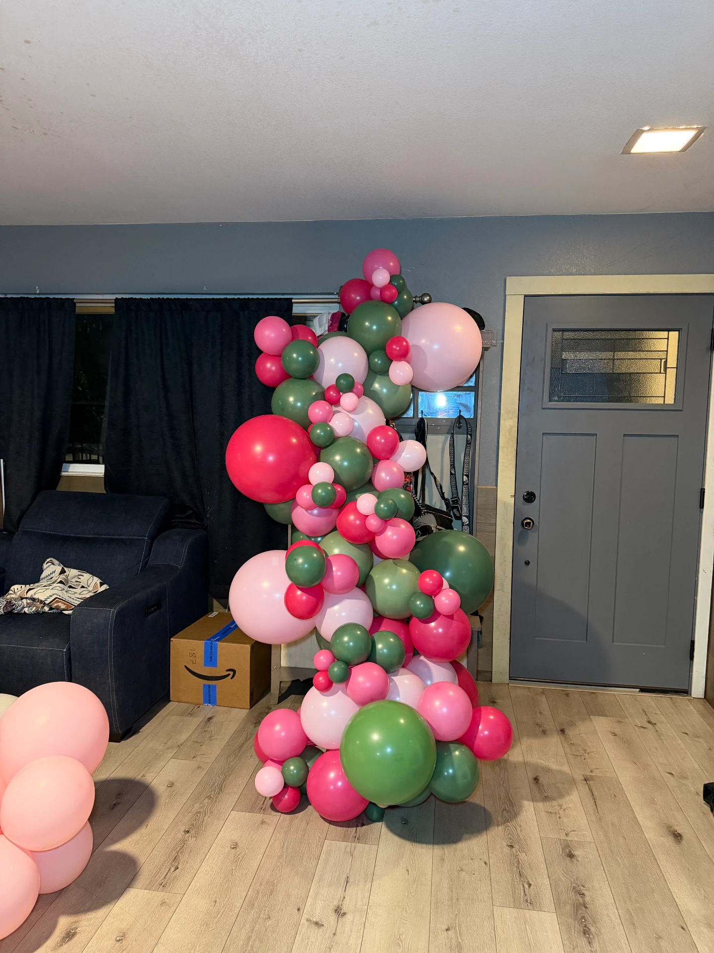 Pink and green organic balloon garland for a celebration